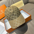 Louis Vuitton monogram baseball cap in tan with dark brim edge and top button