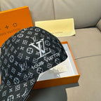 Monogram baseball cap, black with small repeated icons and raised front patch