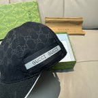Gucci cap in dark GG monogram with GUCCI logo band on the side.