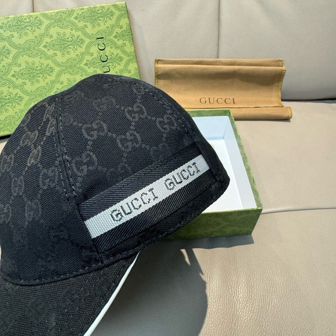 Gucci cap in dark GG monogram with GUCCI logo band on the side.