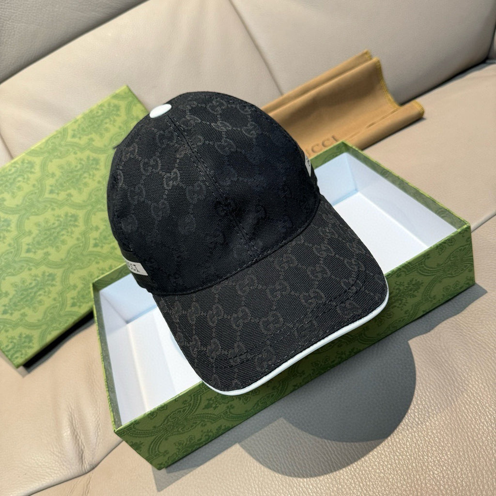 Gucci cap in dark GG monogram fabric with white-trim brim edge, side view.
