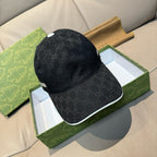 Gucci cap in dark GG monogram fabric with white-trim brim edge, side view.