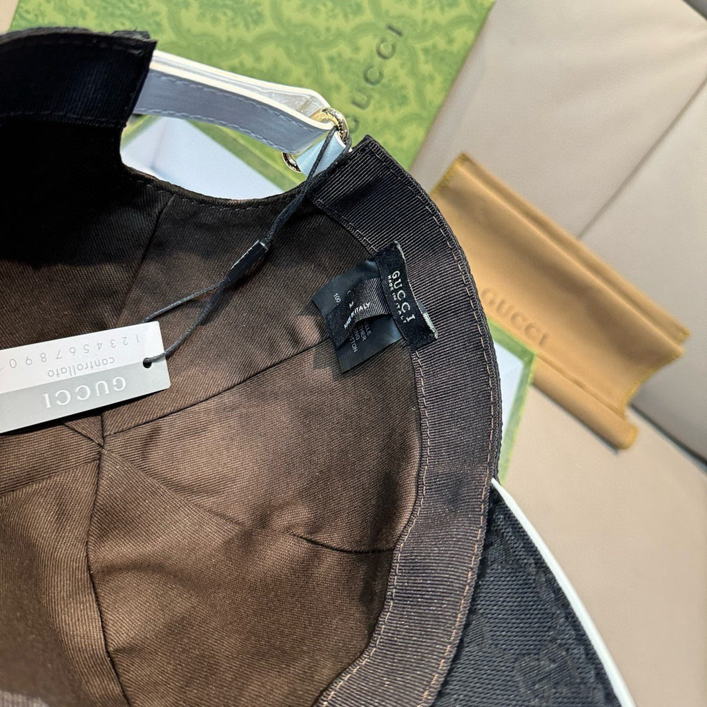 Gucci cap interior view with adjustable strap and fabric tag inside.