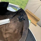 Gucci cap interior view with adjustable strap and fabric tag inside.