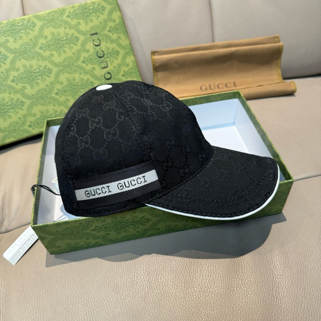Gucci baseball cap in dark GG monogram with GUCCI logo band and curved brim.