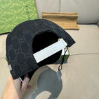 Gucci cap back view with dark GG monogram and white inner label near opening.