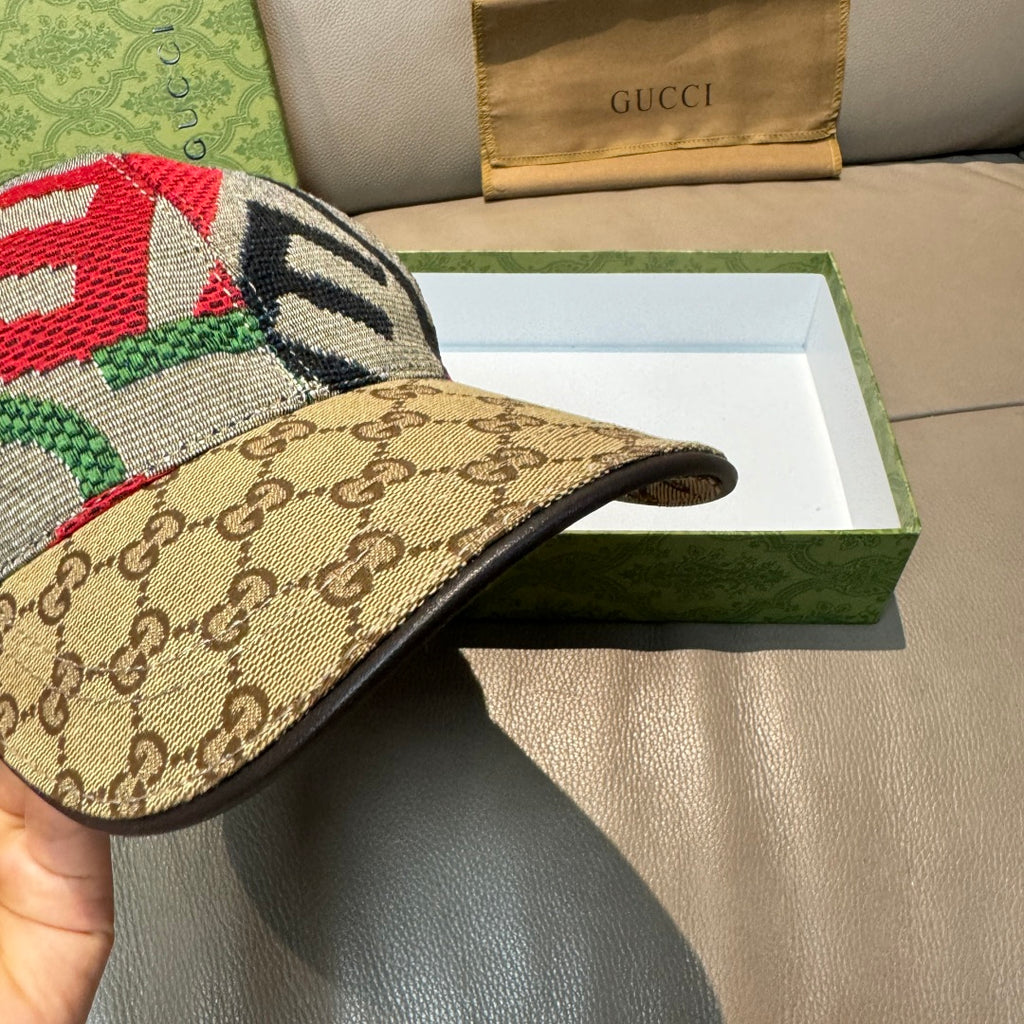 Gucci cap side view with beige GG canvas brim and multicolor embroidered top