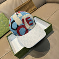 Gucci cap with white jacquard brim and blue-red logo-style knit crown