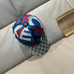 Gucci cap with multicolor knit crown and GG monogram brim, side view