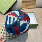 Gucci cap with multicolor knit crown and GG monogram brim, top button detail
