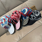 Set of three Gucci baseball caps in multicolor monogram with curved brims.