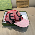 Pink brim baseball cap with bold red and black graphic lettering pattern
