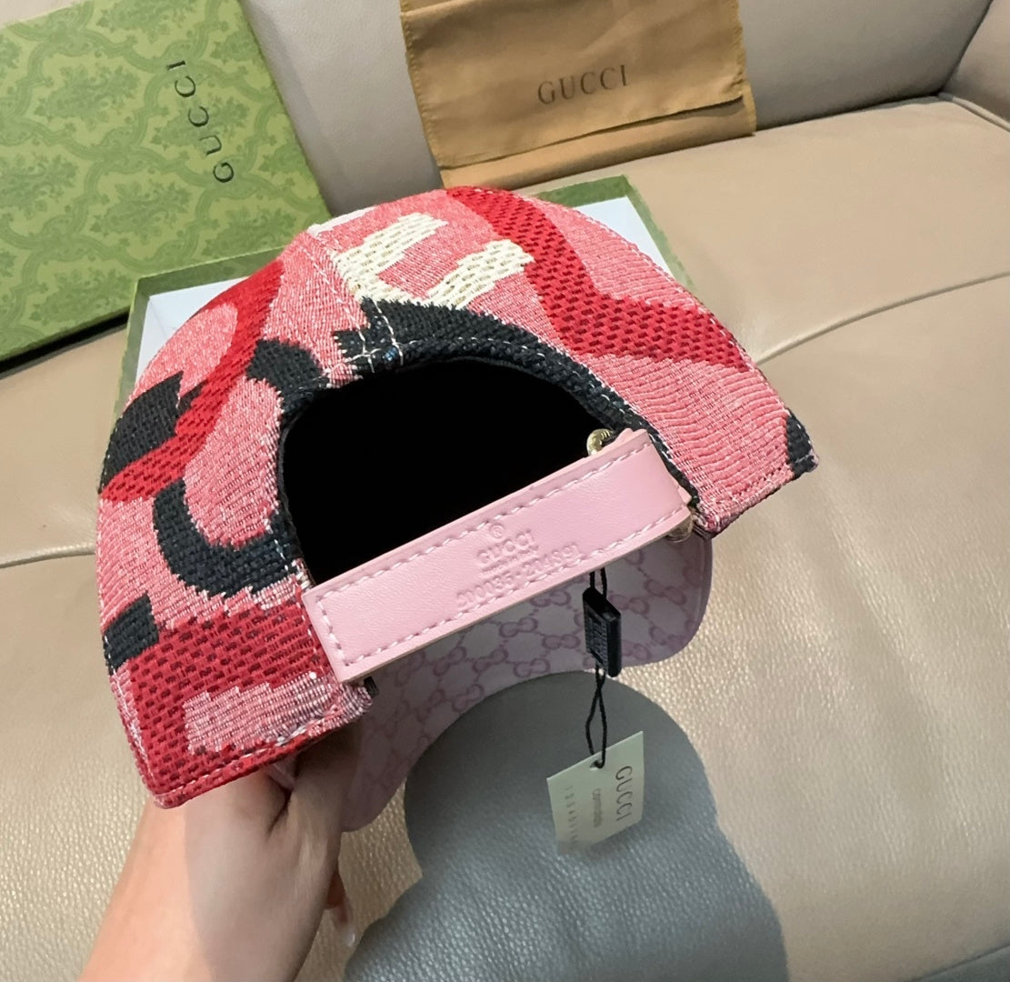 Baseball cap with patterned crown and pink leather-look strap, open side view