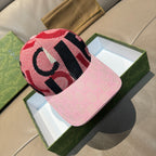 Gucci baseball cap with pink logo brim and red-black patterned crown