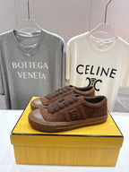 Fendi unisex brown suede sneakers with fuzzy laces and rubber sole