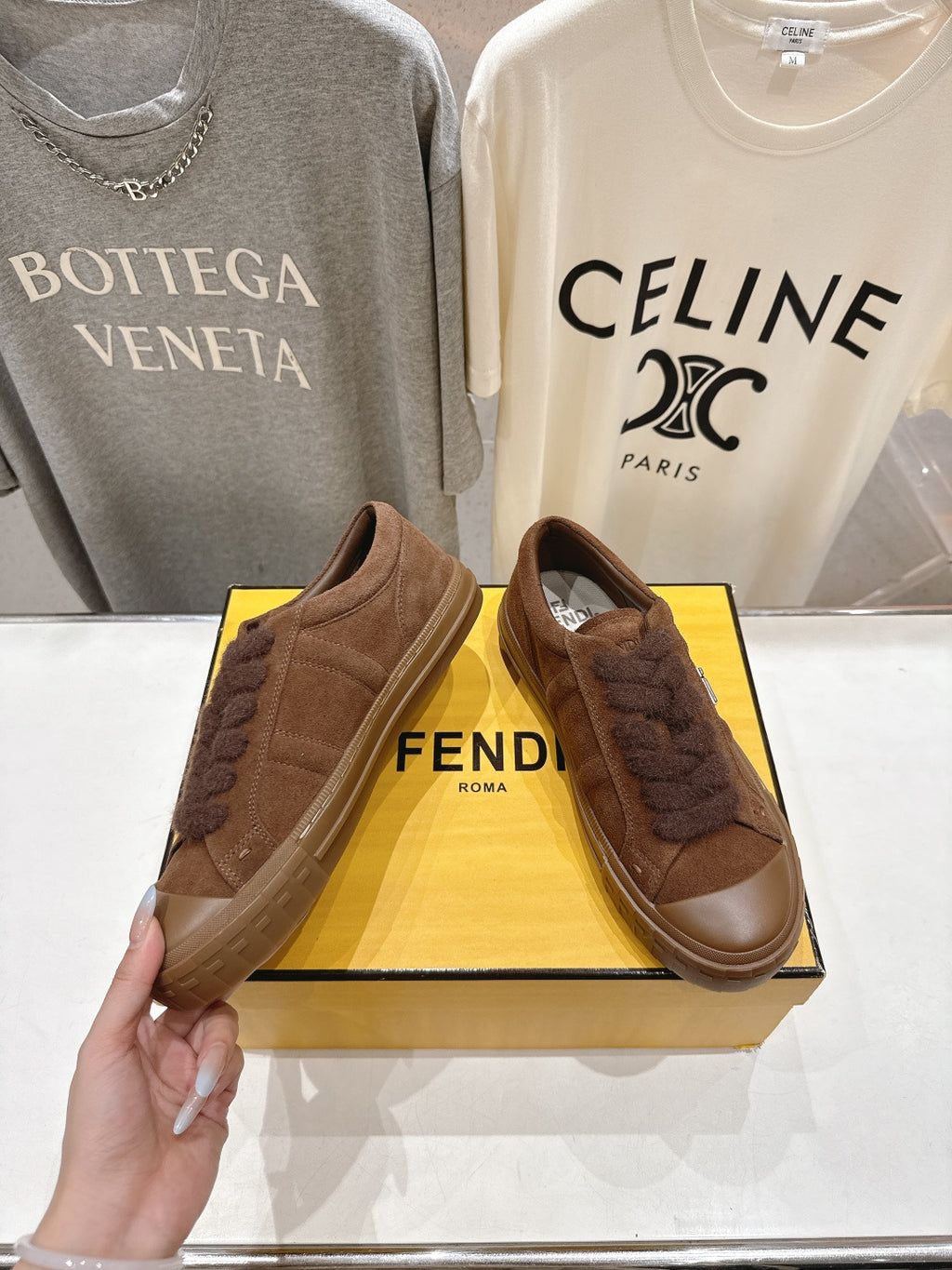 Fendi unisex brown slip-on shoes, side view with textured upper