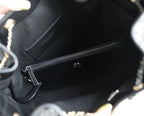 Chanel bag interior with zip pocket and fabric lining, viewed from inside