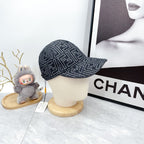 Fendi-style monogram baseball cap, side profile, dark navy repeating pattern
