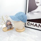 Fendi light blue patterned baseball cap with curved brim, side view.