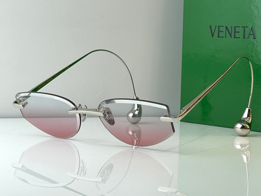 Glasses with light metal frames and pink tinted lenses