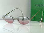 Glasses with light metal frames and pink tinted lenses