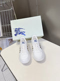 White low-top sneakers with blue horse logo on tongue and front lace area