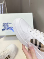 White low-top sneakers with blue horse logo tongue and check-pattern side detail