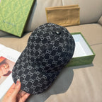 Black GG-style monogram baseball cap, side view with round top button.