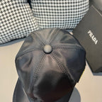 Black satin baseball cap with top button crown and stitched panels