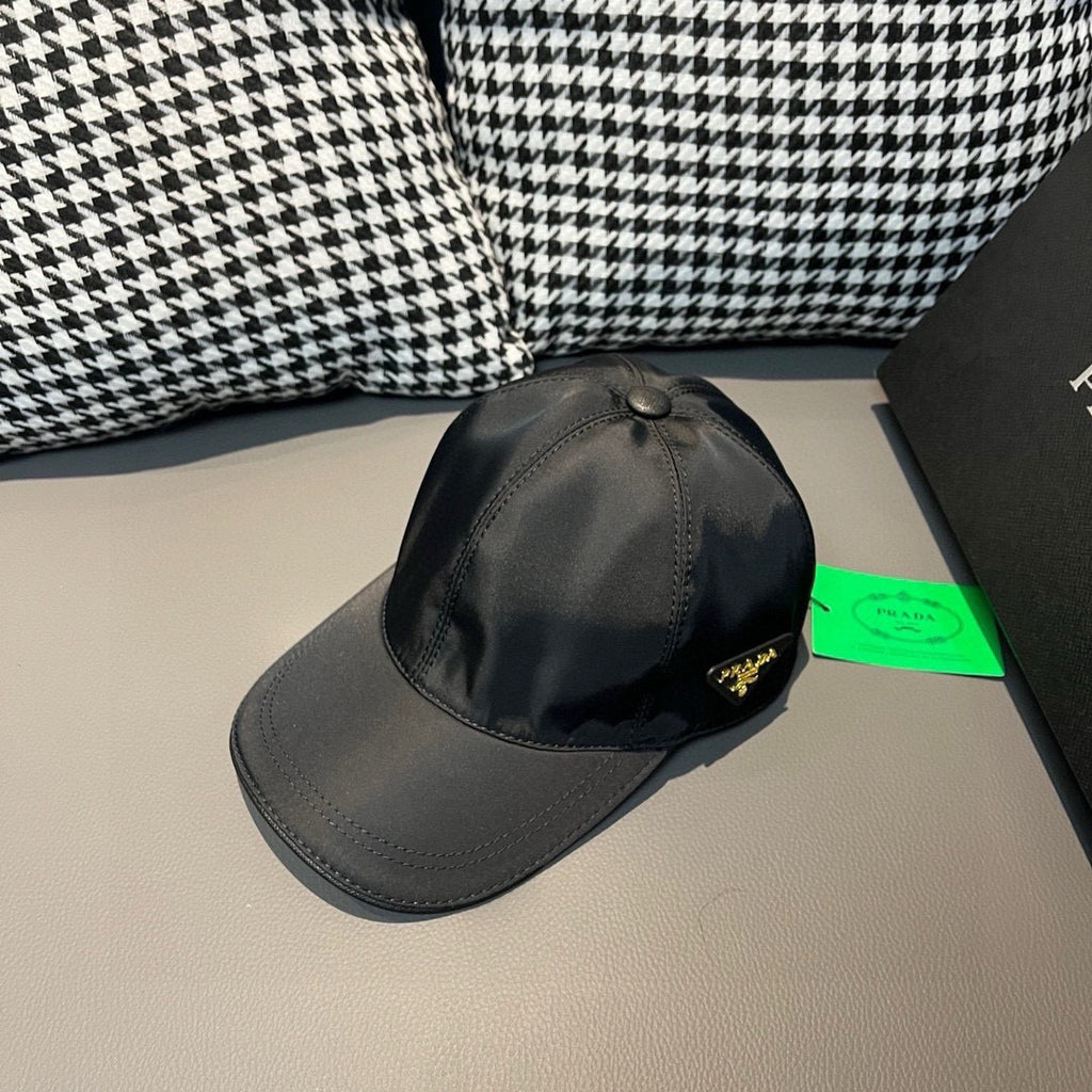 Black satin baseball cap with curved brim and small side logo patch