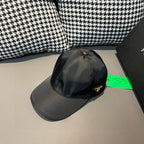 Black satin baseball cap with curved brim and small side logo patch