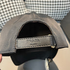 Black satin baseball cap interior with PRADA-printed strap