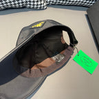 Black satin baseball cap with interior lining tag and curved brim