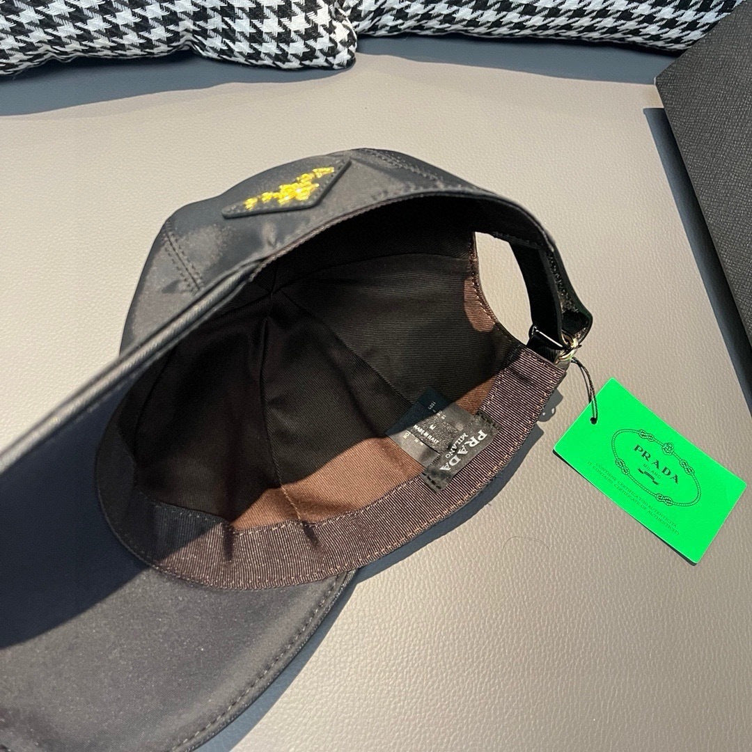 Black satin baseball cap with interior lining tag and curved brim