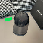 Black satin baseball cap, curved brim, and PRADA logo patch