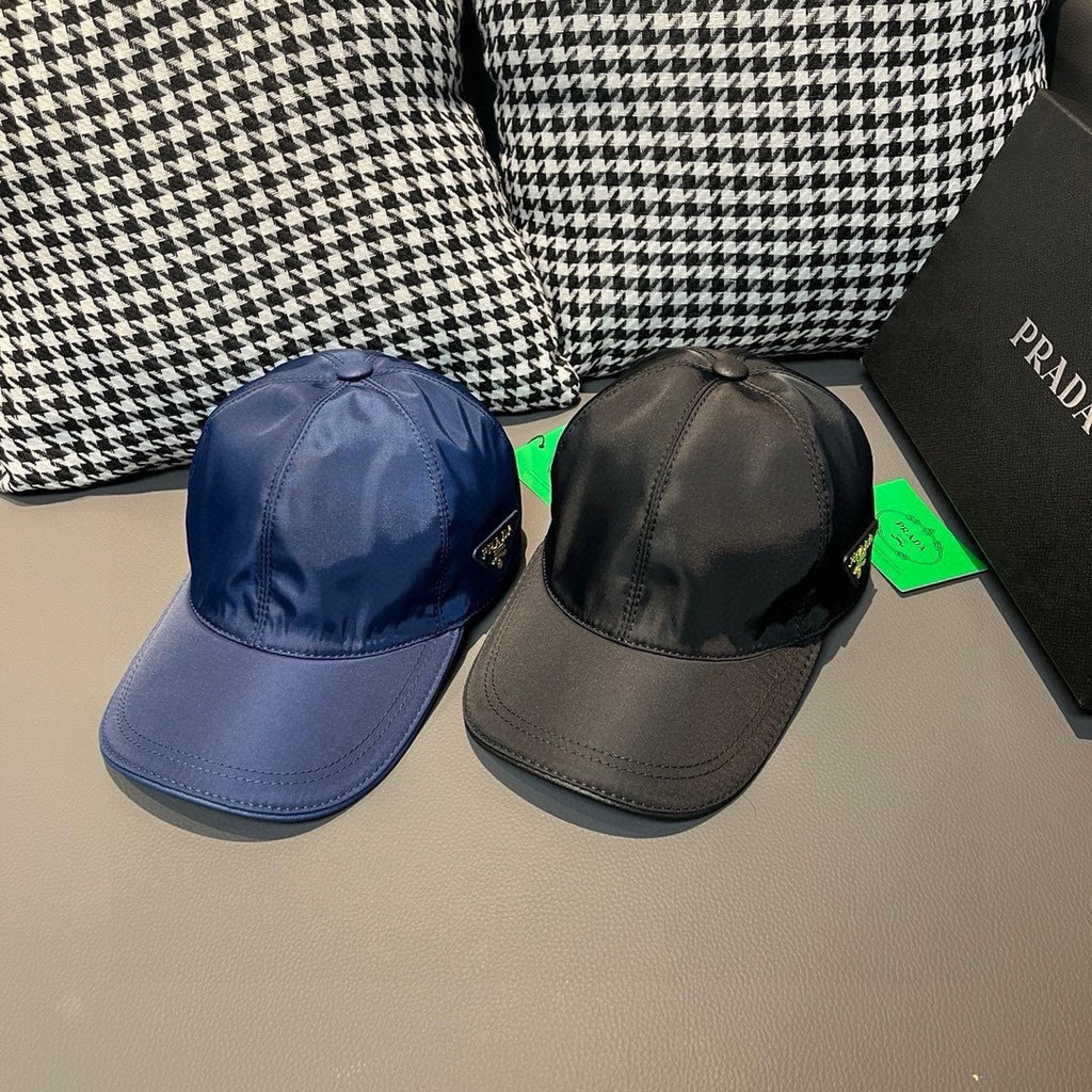 Blue and black satin baseball caps with PRADA logo patches