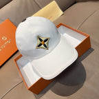 Light blue baseball cap with embroidered four-point star logo on front