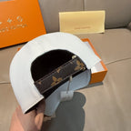 White cap with interior black canvas band and adjustable strap