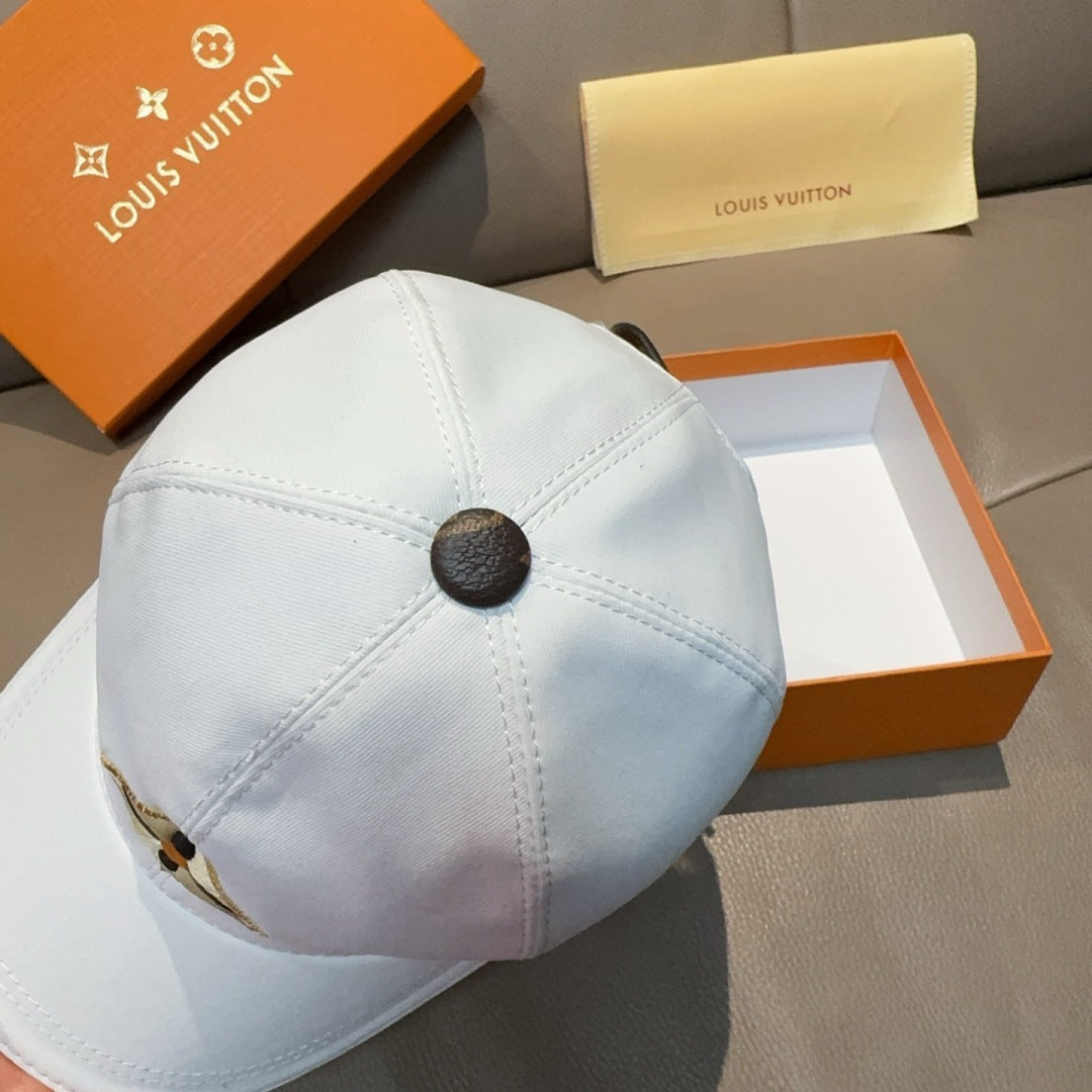 Light blue baseball cap back view with round leather-look button center seam