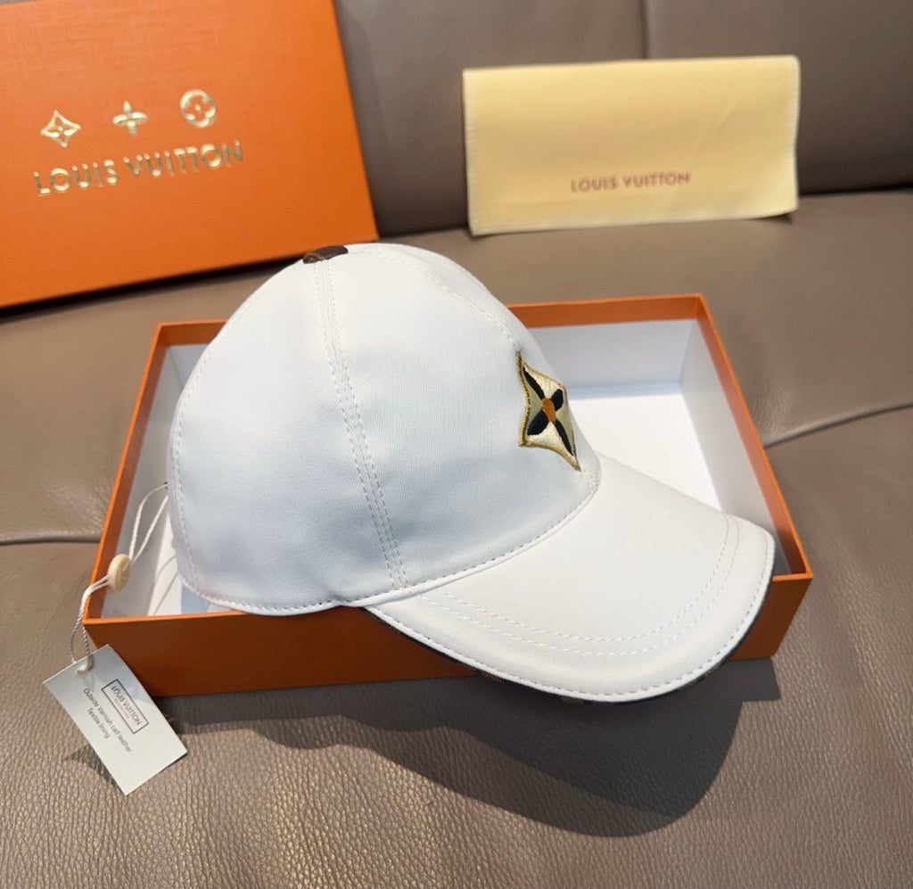 Light blue baseball cap on box, featuring embroidered star logo on curved front