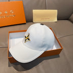 Light blue baseball cap with gold, black, and yellow star logo and curved brim