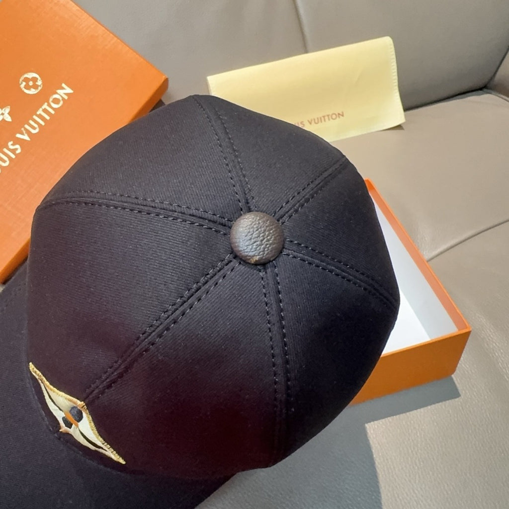 Black Louis Vuitton baseball cap back with round button and stitched panels.
