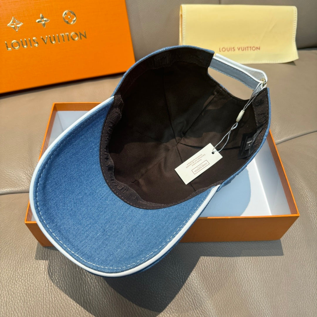 Blue denim cap interior shown, black lining, curved brim, inner label