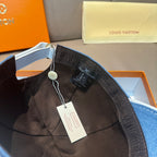 Blue denim cap interior with adjustable strap, lining detail, hanging tags