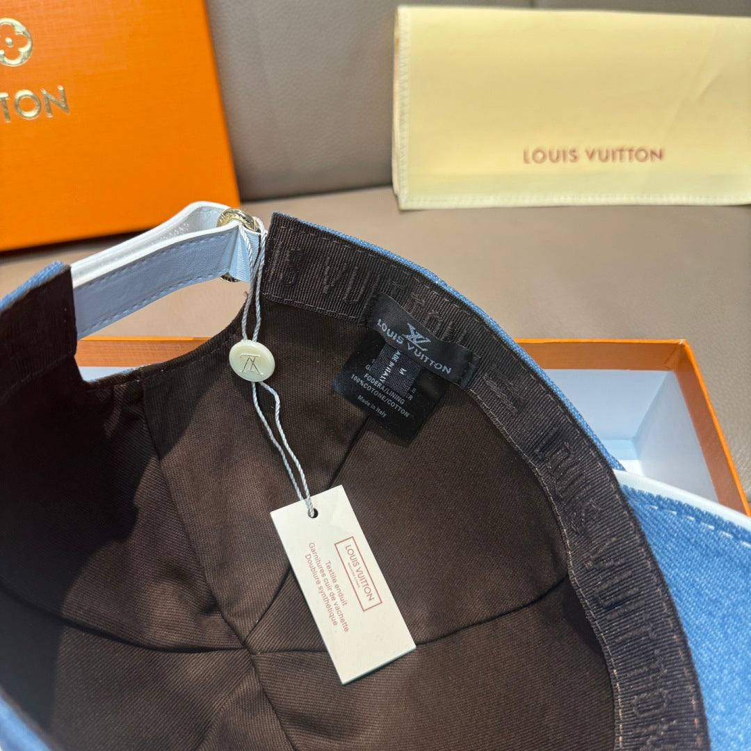 Blue denim cap interior with adjustable strap, lining detail, hanging tags