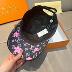 Louis Vuitton cap with black interior lining and pink floral monogram brim, back view