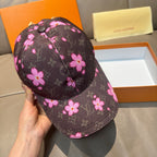 Louis Vuitton cap, side view in dark brown with pink flower pattern