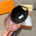 Brown monogram baseball cap with pink floral print, showing interior lining