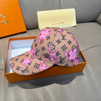 Brown monogram baseball cap with pink floral print, curved brim, and top button