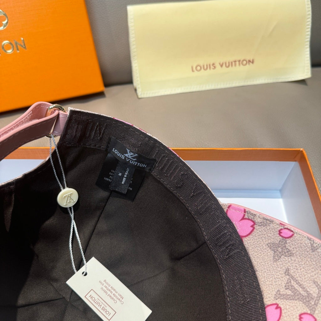 Louis Vuitton baseball cap in black with pink floral lining and logo tag